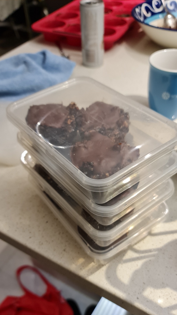 Stacked containers of the finished chocolate slices